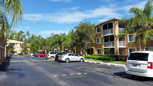 Assigned parking feet from apartment and ample guest & additional parking - 1875 Florida Club Dr