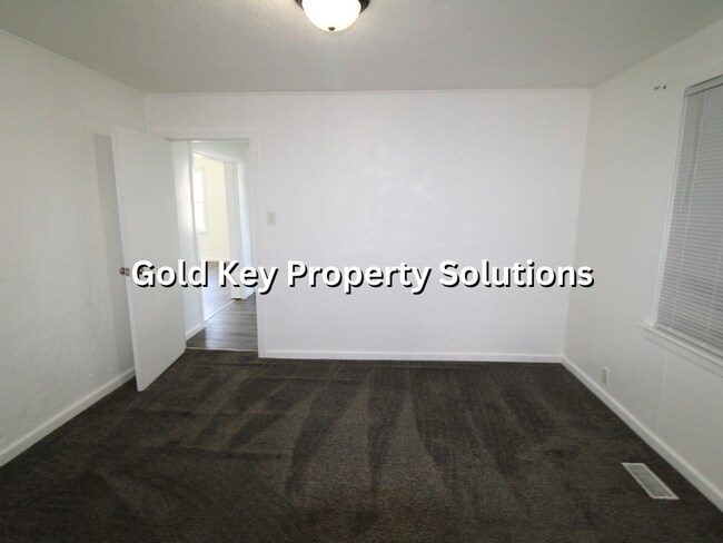 Building Photo - 2 BR 2 BA House with 2-Car Garage and Cent...