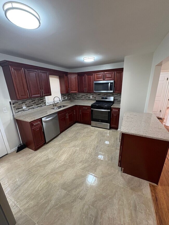 Building Photo - Cozy 3 Bedroom / 2 Bath Updated Home with Large Fenced Yard and Brand-New Multi-Level Deck