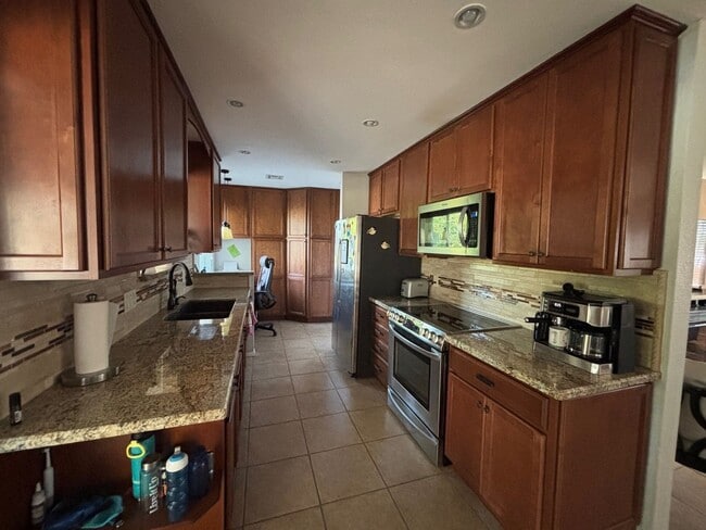 Building Photo - Welcome to this stunning updated 2-bedroom, 2-bathroom home on a lake located in the vibrant comm...