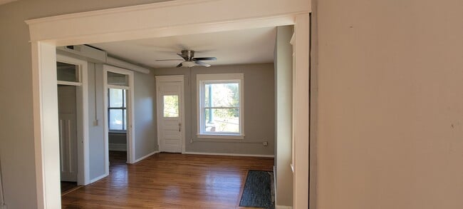 View across dining room into living room, door to balcony - 1824 Summit St