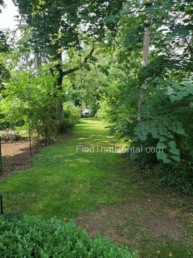 Building Photo - Charming Historic Retreat with Private Fenced Yard & Parking – Prime Downtown Location