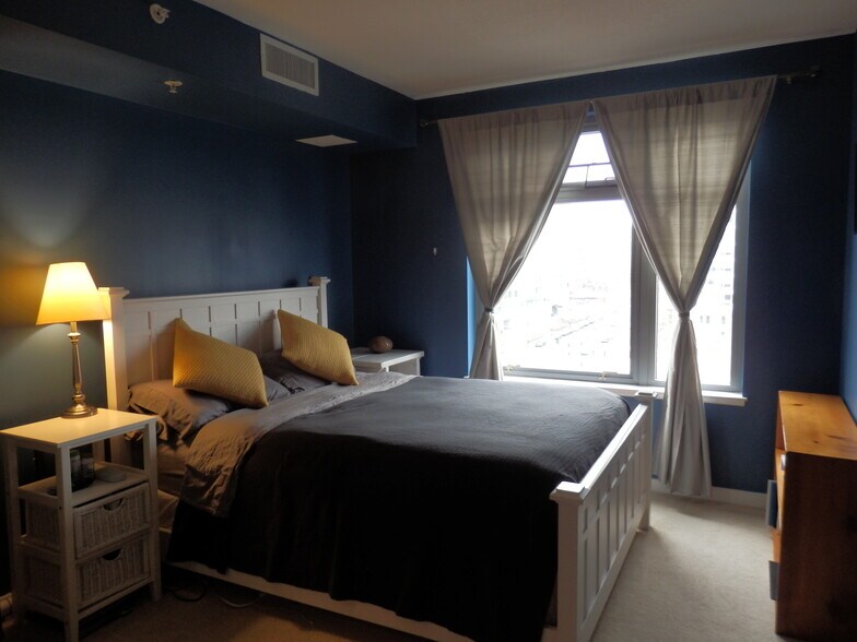 Master Bedroom with walk-in closet (adjustable Elfa shelves). - 475 K Street Northwest