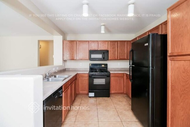 Building Photo - 6050 W Pueblo Ave