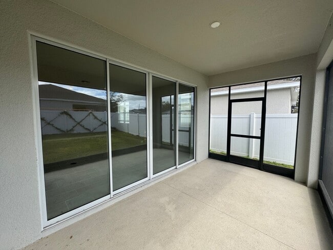 Building Photo - Where Modern Comfort Meets 4BD/3BA Hometown Charm — Your Story Begins in Okahumpka! FULLY-FENCED!...