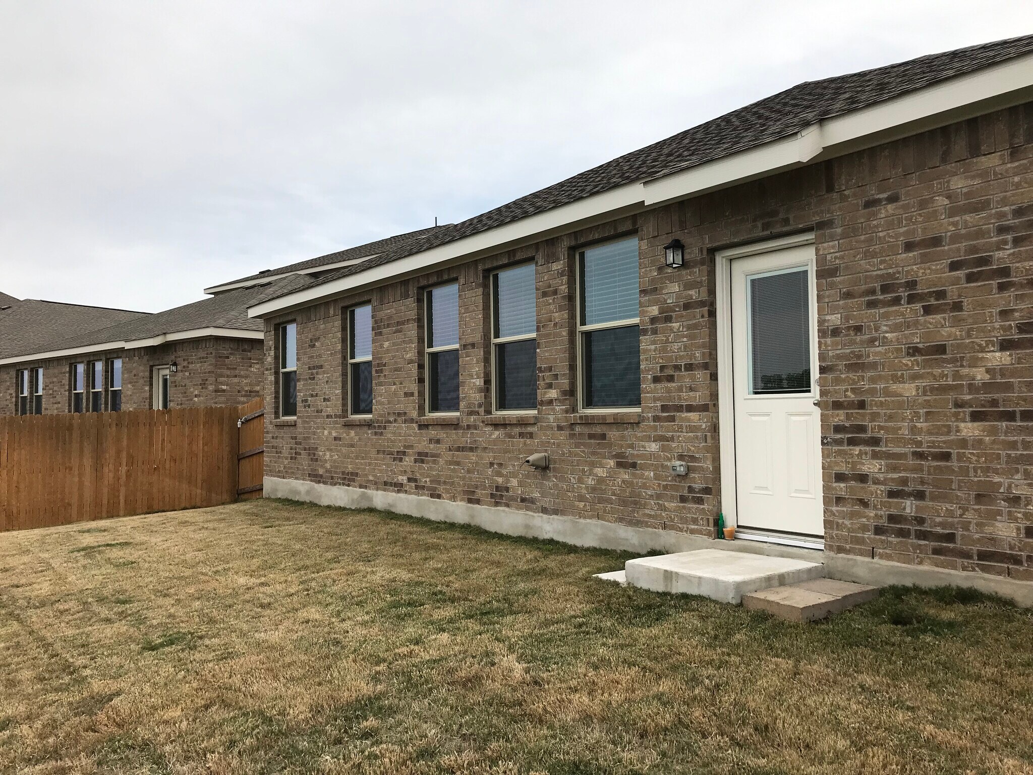 The back of the house with privacy fence - 1313 Eagle Ridge Trl