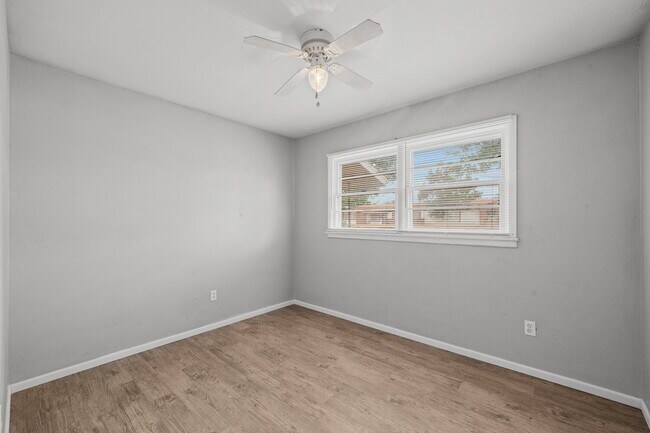 Building Photo - Updated Home with Gorgeous Floors & Large Backyard