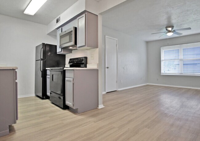 Modern Kitchen – Updated kitchen with appliances at The Adelaide Apartments - Adelaide