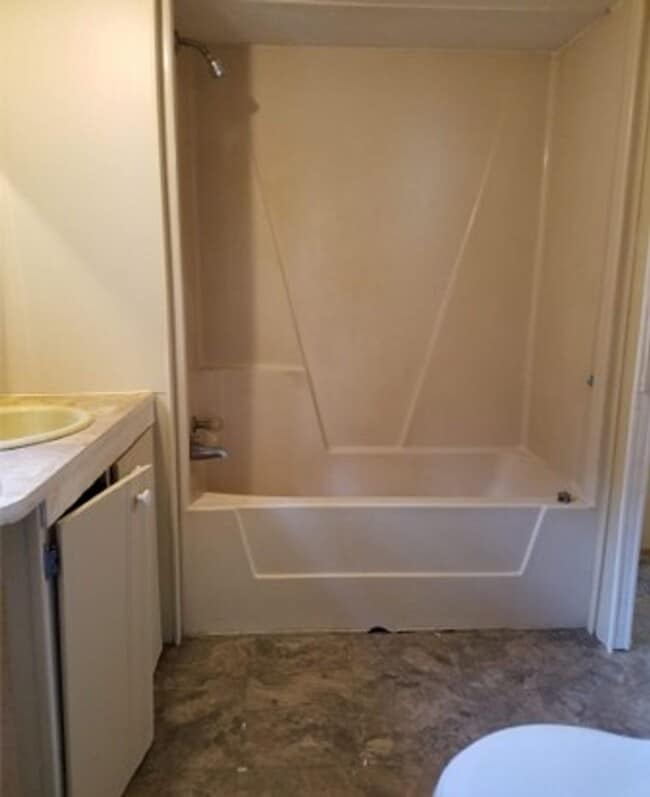 Building Photo - Freshly painted spacious 2-bedroom 1-bath home with a screened porch and storage shed.