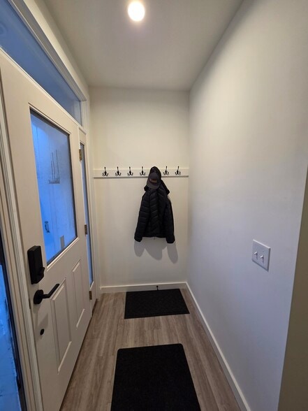 Unit 1 Entry Mudroom with Coathooks and Closet - 73 Goshen Rd