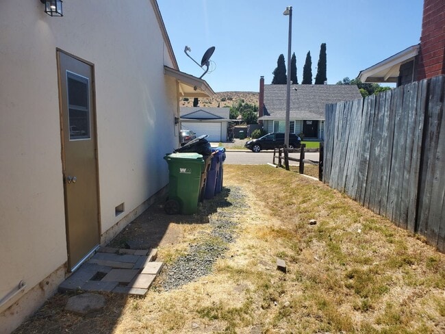 Building Photo - Corner lot detached SFR with a fenced yard in a wonderful neighborhood available 12/20/2025.