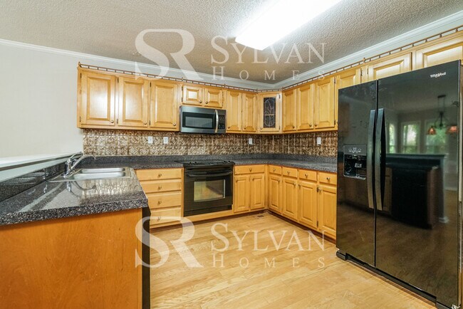 Building Photo - The living is easy in this 4 bedroom, 2.5 ...