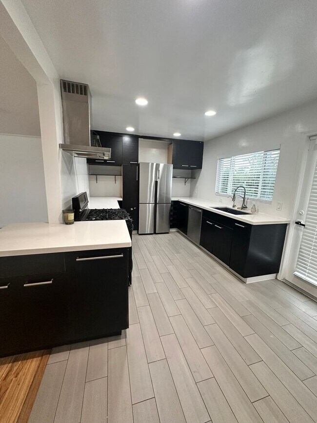 Building Photo - Don't miss out - Single family home close to the beach - LARGE yard, 2 bed 1 bath with bonus studio