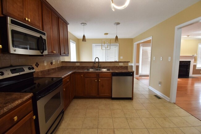 Building Photo - Coming Soon!! 4 Bedroom 2.5 Bath Nicely Renovated with Updated Fixtures! - No Pets