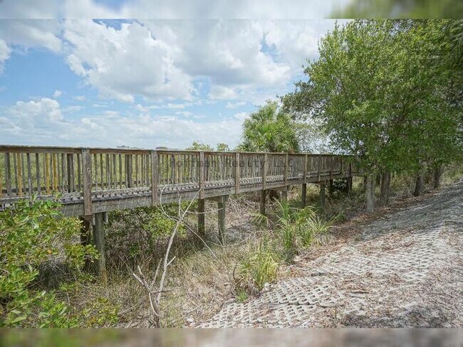 Building Photo - Beach Walk Condo | 2BR/2BA with Bay Views