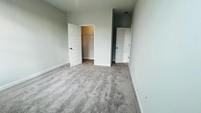 Building Photo - BRAND NEW & Beautiful Townhome with 2 car ...