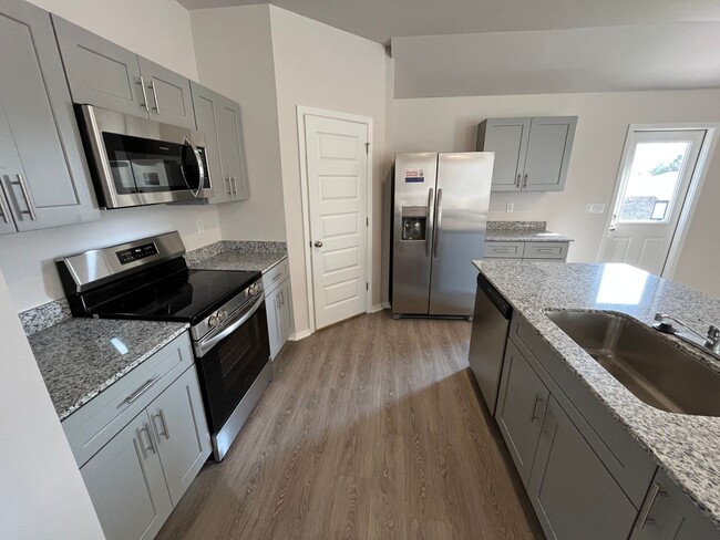Building Photo - Pre-Leasing Now! Discover Modern Living in This 4-Bedroom, 2-Bath Home at Cottages at Clear Creek