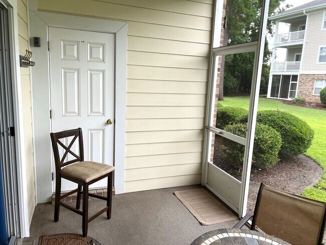 Building Photo - First Floor, 2 Bedroom, 2 Bath Condo with Screened Patio! Community Pool! Available Now!