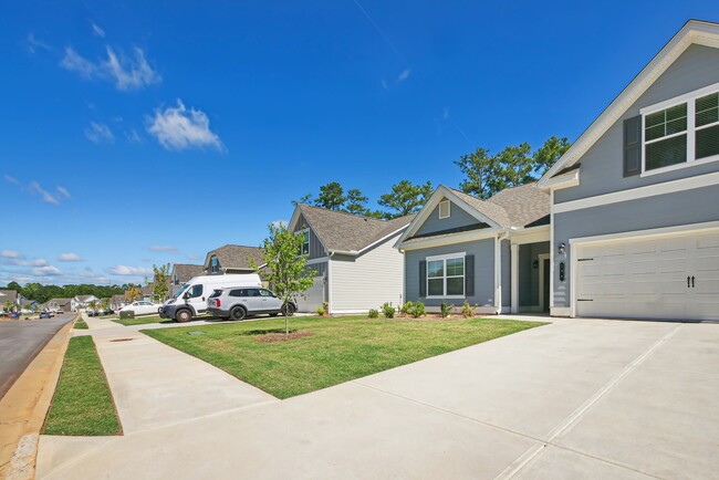Exterior shot of Salem Oaks, two story homes with a private driveway and attached garage. - Salem Oaks