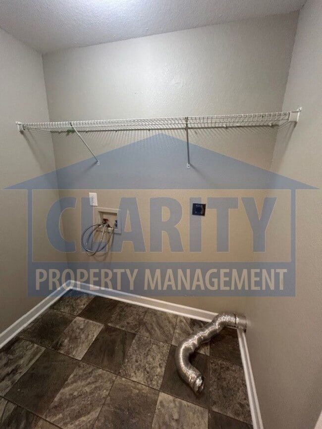 Building Photo - Charming three-bedroom home with carport!