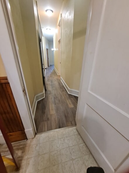 Hall looking from kitchen to front room - 129 Main St