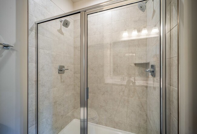 Building Photo - This 3-bedroom, 3-full bathroom townhouse offers a pristine and contemporary living experience.