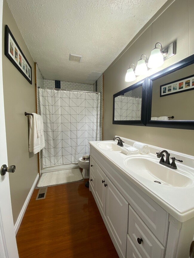 bathroom with double vanity - 9001 Shaun Landing Cir