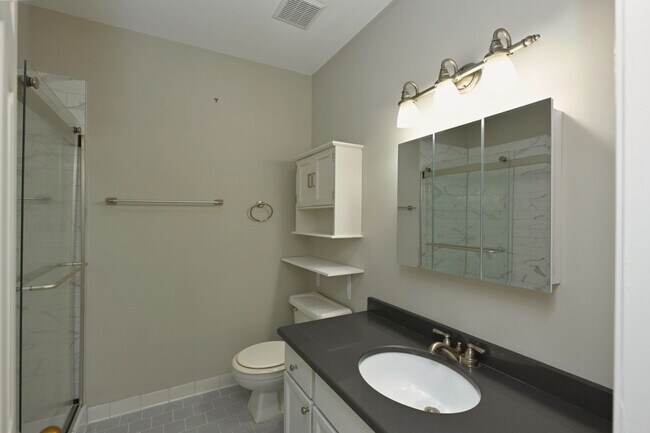 Building Photo - **UPDATED FIRST-FLOOR CONDO IN DESIRABLE P...