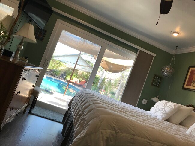 View from master bedroom with large dresser and walk-in closet. - 3822 Berryman Ave