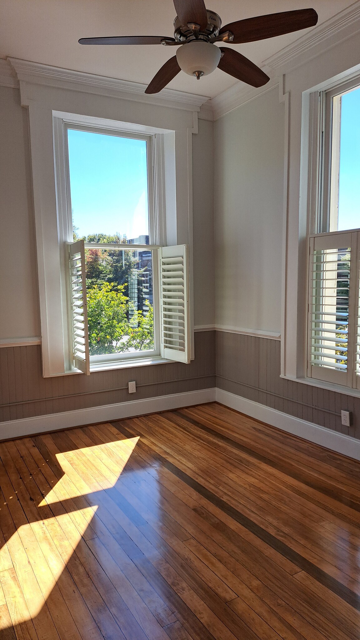 Second photo of living room with views of Broad and Center Streets. - 101 E Broad St