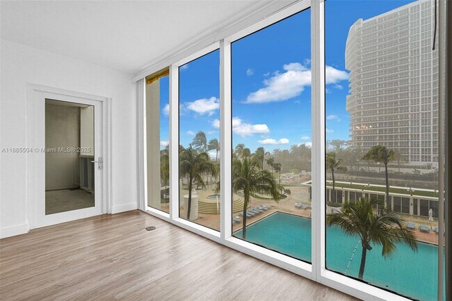 Building Photo - 10275 Collins Ave