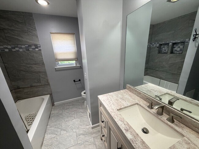 Building Photo - Renovated 3BR Split-Level on a Spacious Corner Lot with Garage in Toms River