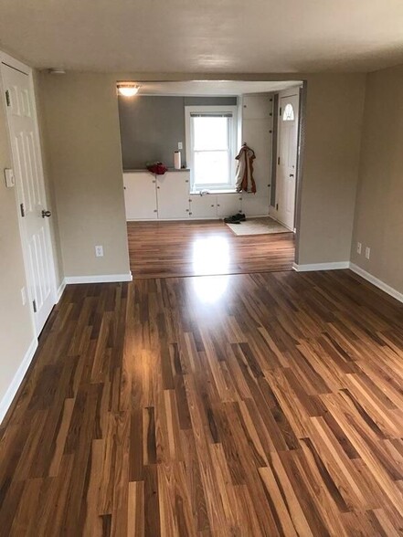 Living room looking into kitchen - 25 W Main St