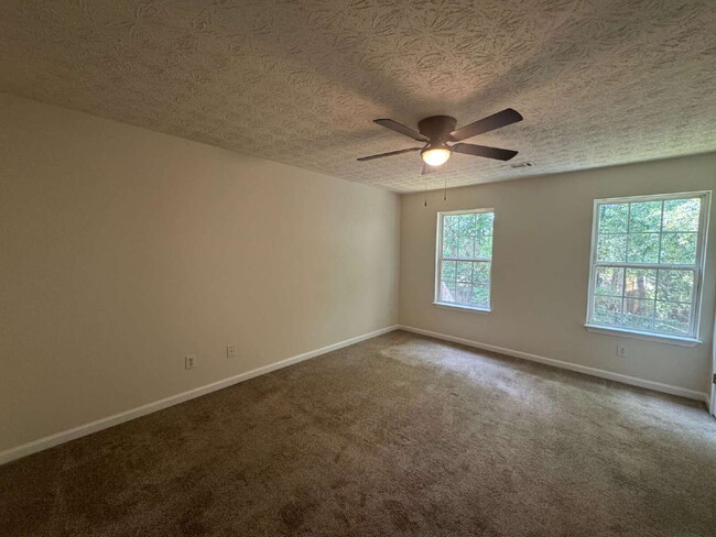 Building Photo - Built in 2004, this two-story townhouse in the Wellington Walk community offers 1,205 square feet...