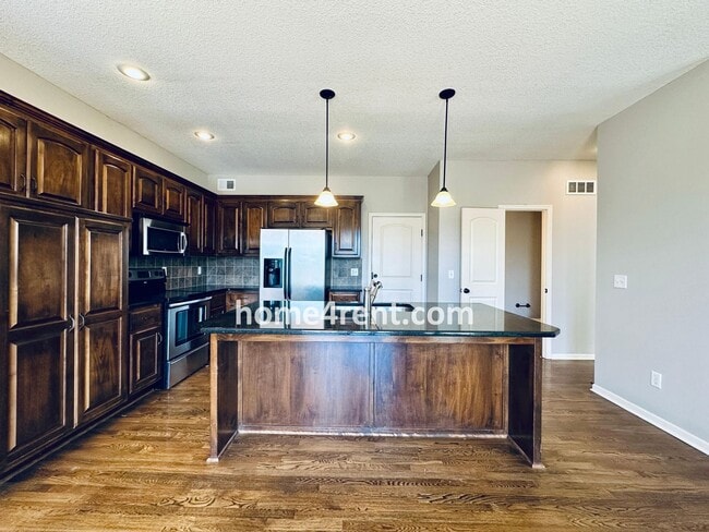 Building Photo - Gorgeous Olathe, 5 BR Home w/ Wood floors,...