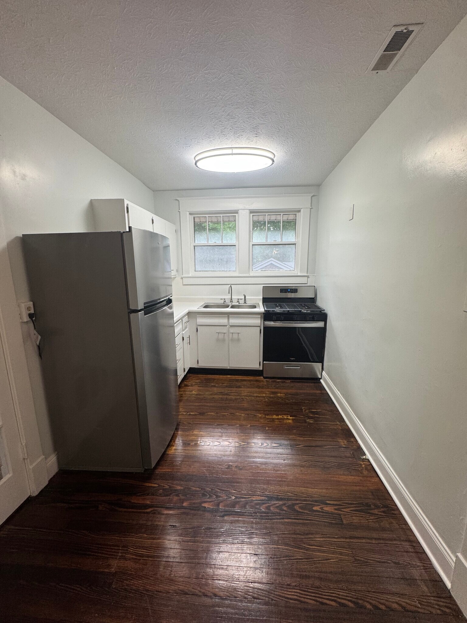 Kitchen with brand new whirlpool refrigerator and range - 1333 Castlewood Ave