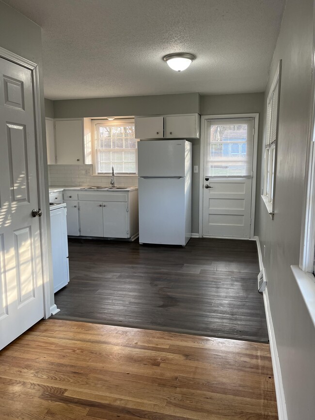 Unit H kitchen from living room - 5947 Raytown Rd