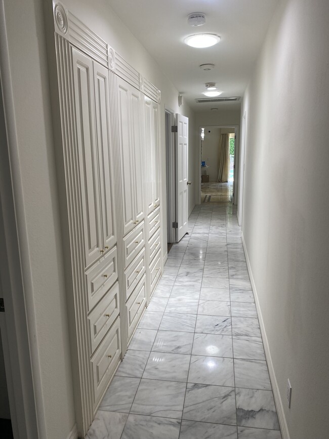 Marble floors in hallway, dining room and living room. - 125 N Oakhurst Dr