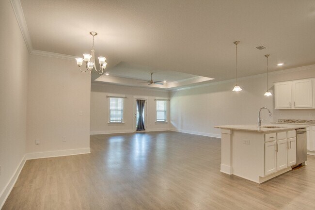 Building Photo - Spacious Cantonment Townhome with Open Layout, 2-Car Garage, Covered Back Porch & Easy Access to ...