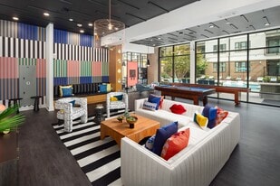 Resident Social Space Featuring Lounge Seating, Billiards, and Colorful Décor - 675 N. Highland