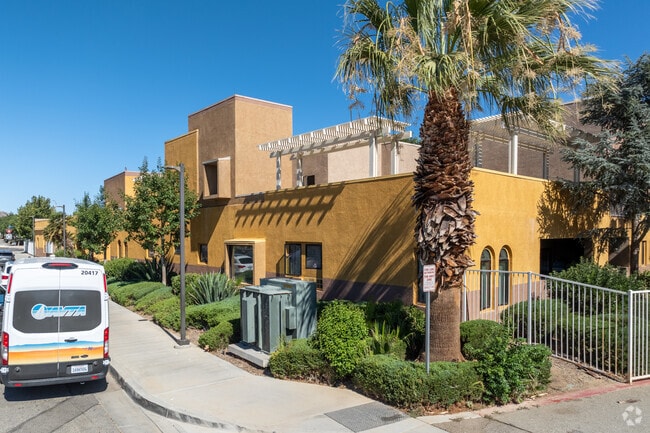 Primary - WHISPERING PALMS SENIOR APARTMENTS