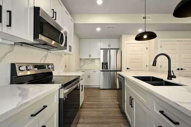 Building Photo - Three Bedroom Townhome with Large Unfinish...