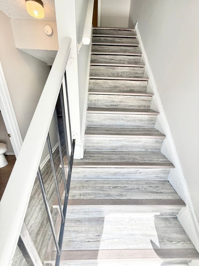 Building Photo - *** RENT READY!! Newly remodeled townhome! ALL Laminate.