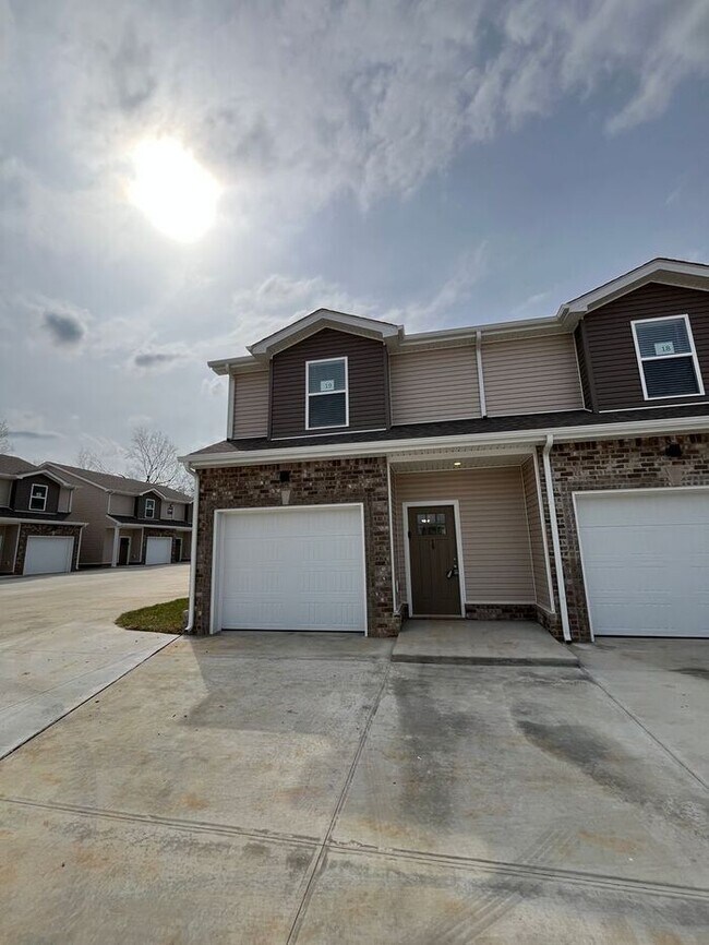 Primary Photo - Charming 2-Bedroom Townhome with Modern Co...