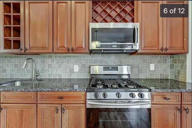 Kitchen cabinetry, countertop, and stainless steel appliances - 262 Prospect Ave
