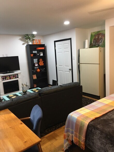 Full size refrigerator in room - 11114 Oak Leaf Dr