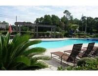 Building Photo - WATERFRONT LIVING! BEAUTIFULLY APPOINTED CONDO ON THE BAYOU IN OS SCHOOL DIST - FULLY FURNISHED