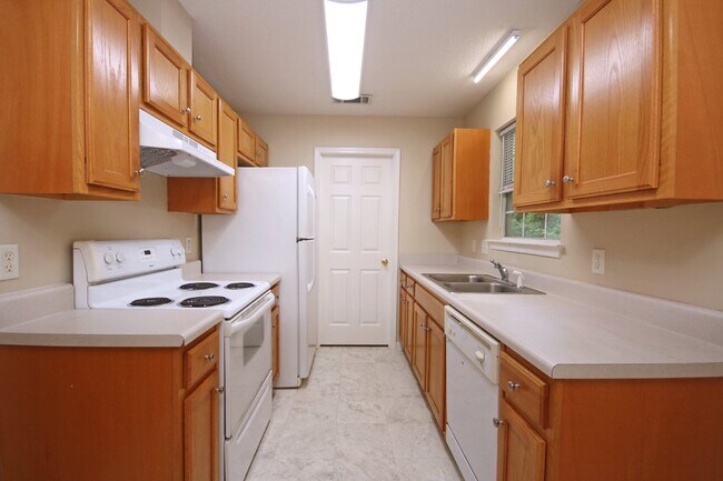 Building Photo - 3BR/2BA Home Near UWF – Wood-Look Flooring, Galley Kitchen, Pet Friendly!