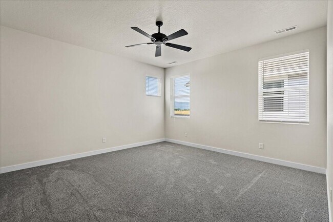 Building Photo - Brand New, Stylish 4-Bedroom Home with Vaulted Ceilings and Private Patio