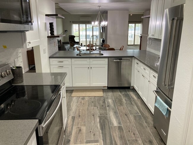 Building Photo - Beachside Furnished Retreat! Remodeled 2BD/2BA Condo Steps from the Sand!